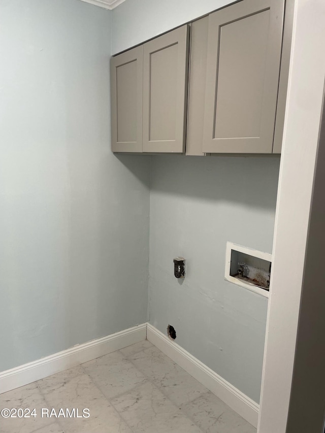 laundry area with hookup for an electric dryer, cabinets, hookup for a washing machine, and light tile patterned floors