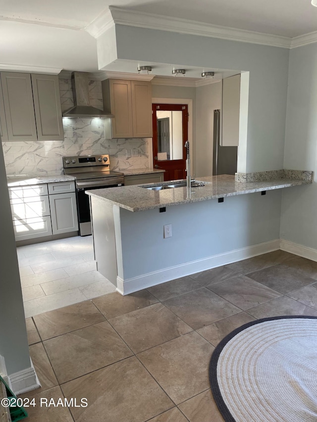 kitchen featuring sink, wall chimney exhaust hood, tasteful backsplash, electric stove, and light tile patterned floors