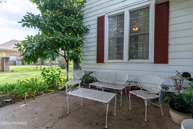 view of patio featuring fence