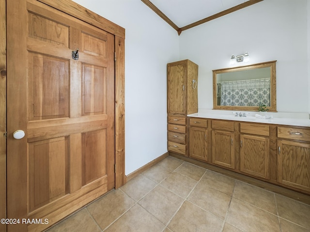 full bathroom with crown molding, vanity, a shower with curtain, baseboards, and tile patterned floors