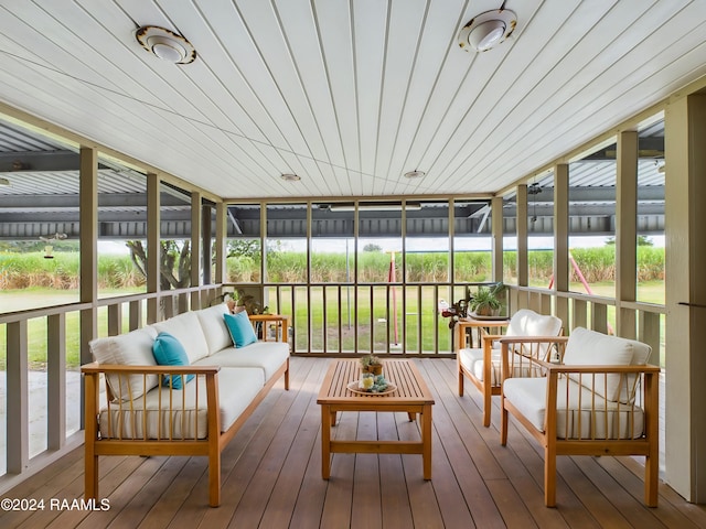 sunroom / solarium with wood ceiling and a healthy amount of sunlight