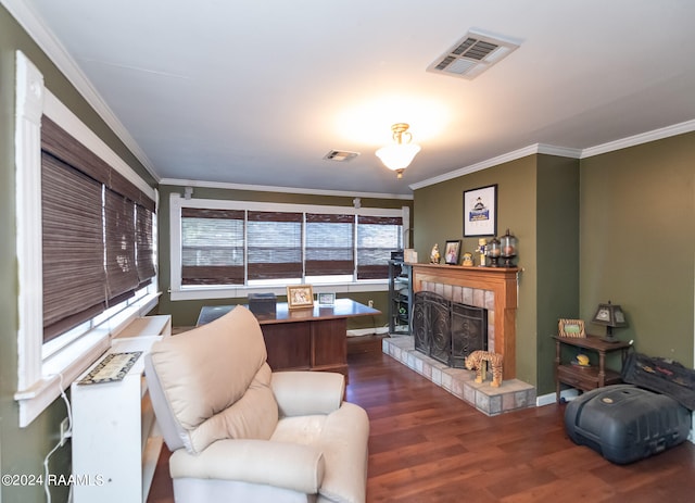 living room featuring dark wood-type flooring, a fireplace, and ornamental molding