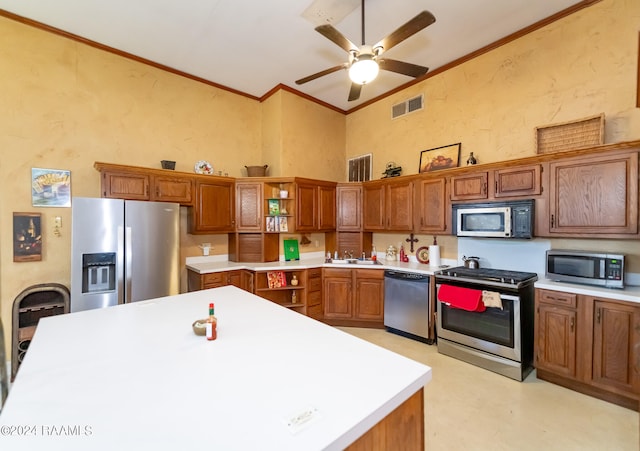 kitchen with stainless steel appliances, ceiling fan, sink, high vaulted ceiling, and ornamental molding