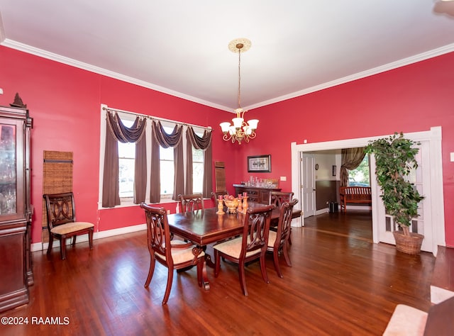 dining space with a wealth of natural light, dark hardwood / wood-style flooring, and ornamental molding