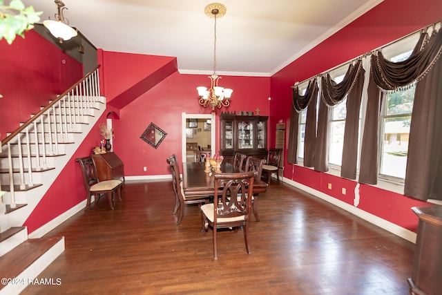 dining area featuring ornamental molding, an inviting chandelier, and hardwood / wood-style flooring