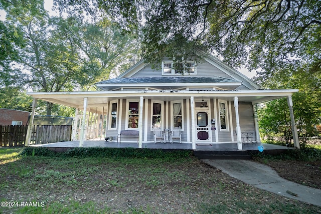 farmhouse inspired home featuring covered porch