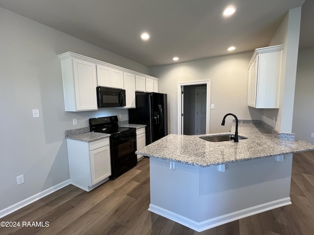 kitchen featuring white cabinetry, sink, dark wood-type flooring, kitchen peninsula, and black appliances