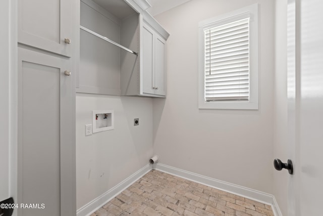 laundry room with washer hookup, cabinets, and hookup for an electric dryer