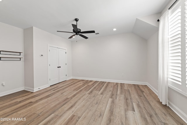 interior space featuring ceiling fan, light hardwood / wood-style flooring, and lofted ceiling