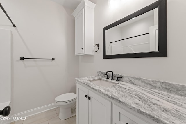 bathroom with tile patterned flooring, a shower, toilet, and vanity