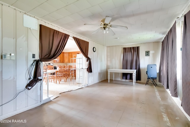 interior space with tile patterned flooring and ceiling fan