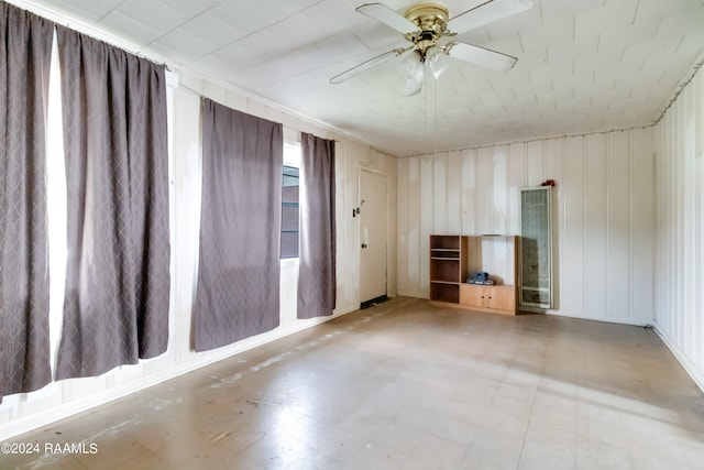 unfurnished room with tile patterned flooring and ceiling fan