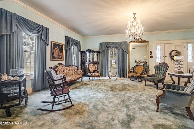 living area with carpet floors, ornamental molding, and a chandelier