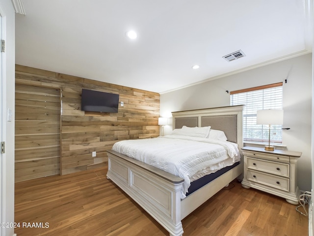 68335 Taulla Dr, Covington, LA 70433 - bedroom with wood walls, ornamental molding, wood finished floors, and recessed lighting