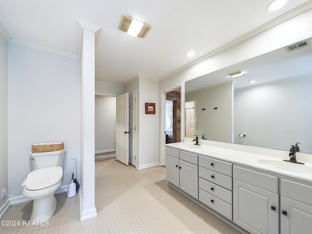 bathroom with crown molding, vanity, toilet, and tile patterned flooring