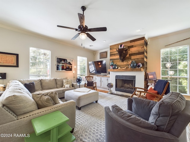 living room with a premium fireplace, a wealth of natural light, ceiling fan, and wooden walls