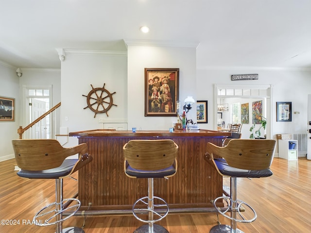 68335 Taulla Dr, Covington, LA 70433 - indoor dry bar with ornamental molding, light wood-style floors, and recessed lighting