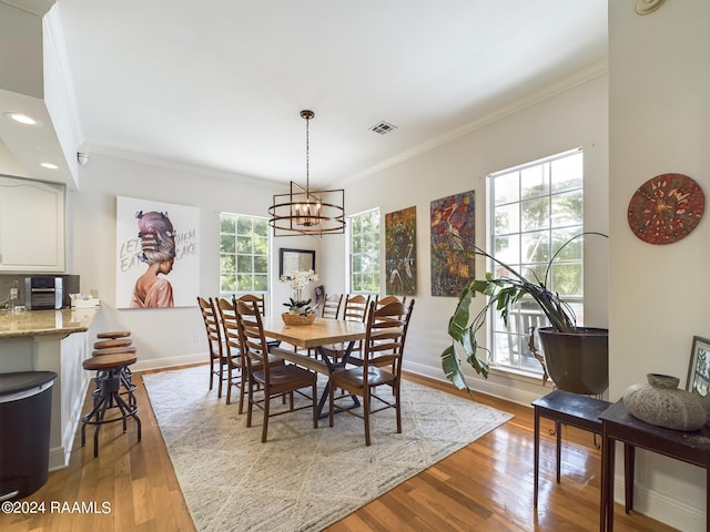 68335 Taulla Dr, Covington, LA 70433 - dining area featuring a chandelier, ornamental molding, wood finished floors, and recessed lighting