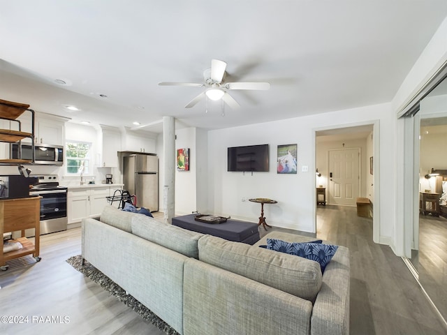 68335 Taulla Dr, Covington, LA 70433 - living area with light wood finished floors and a ceiling fan