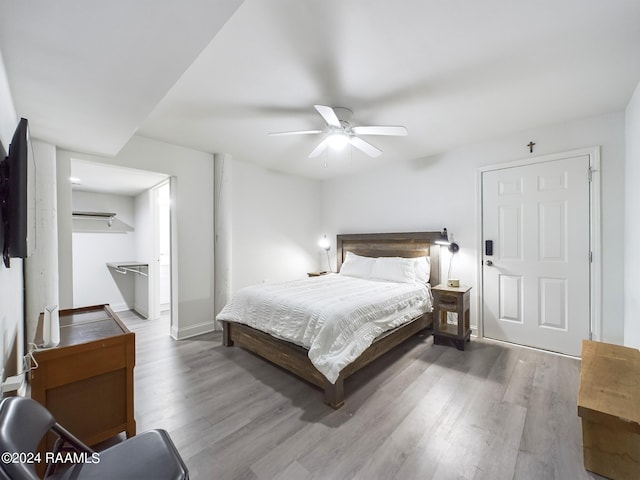 68335 Taulla Dr, Covington, LA 70433 - bedroom featuring wood finished floors and a ceiling fan