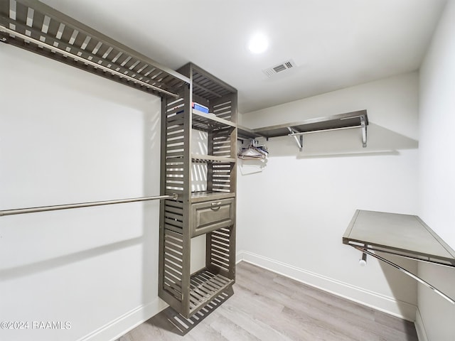 walk in closet featuring light hardwood / wood-style floors