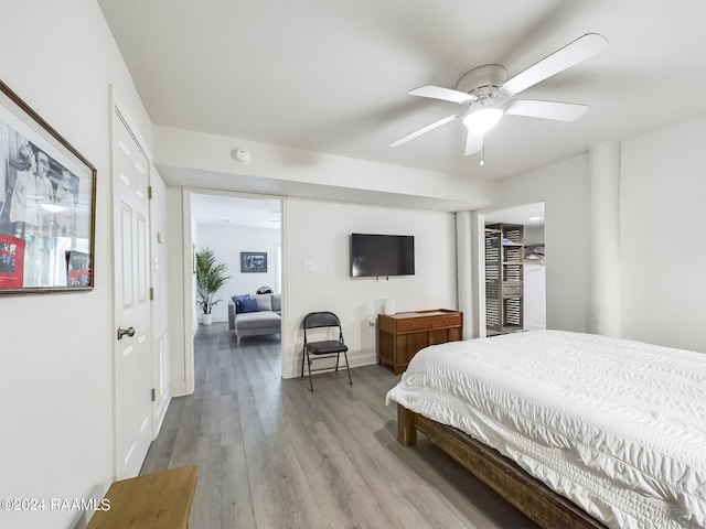 68335 Taulla Dr, Covington, LA 70433 - bedroom with light wood-style floors and ceiling fan