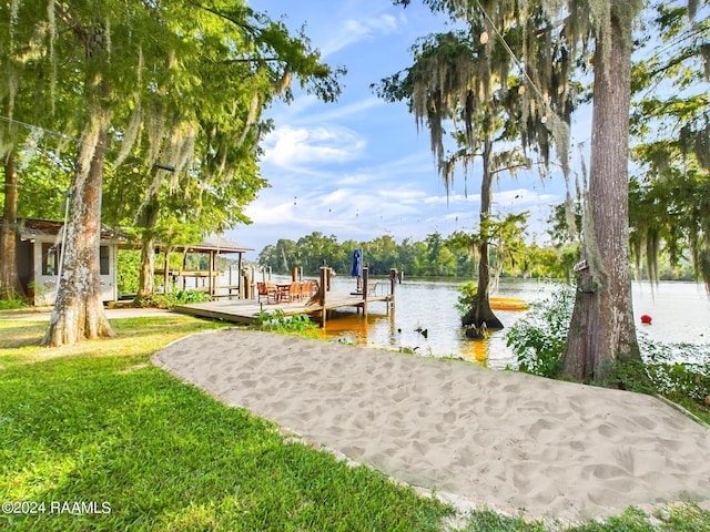 68335 Taulla Dr, Covington, LA 70433 - dock area featuring a lawn and a water view