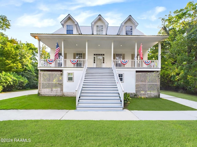 68335 Taulla Dr, Covington, LA 70433 - view of front of house featuring stairway, a front lawn, a porch, and a metal roof