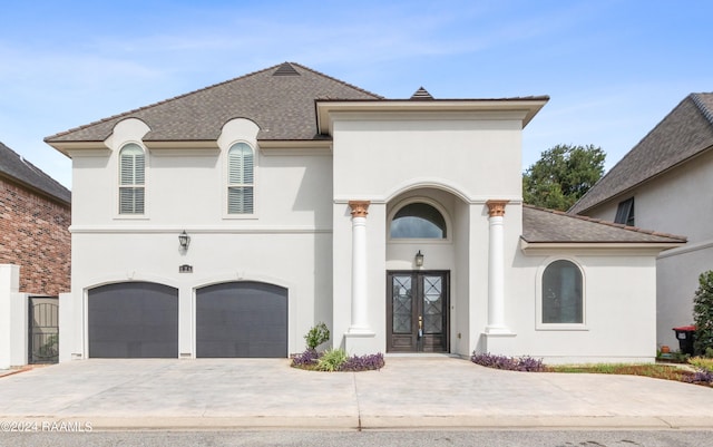 view of front of home featuring french doors and a garage