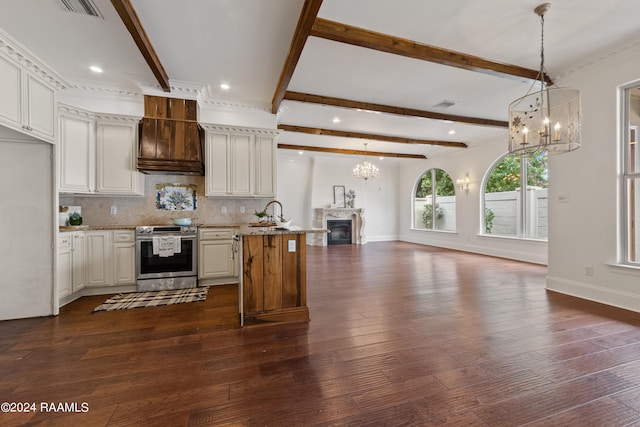 kitchen with dark hardwood / wood-style floors, an inviting chandelier, light stone countertops, stainless steel electric range oven, and decorative backsplash