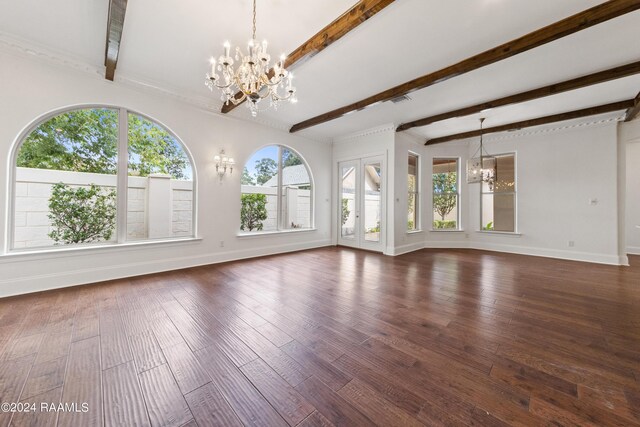 unfurnished living room with dark hardwood / wood-style flooring, a chandelier, and beamed ceiling