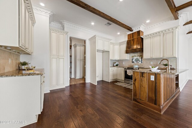 kitchen with dark hardwood / wood-style floors, stainless steel electric stove, light stone countertops, beam ceiling, and crown molding