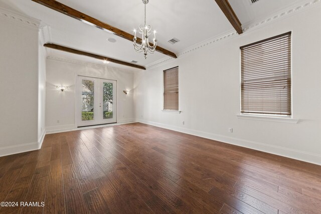 empty room featuring a notable chandelier, crown molding, french doors, dark wood-type flooring, and beam ceiling