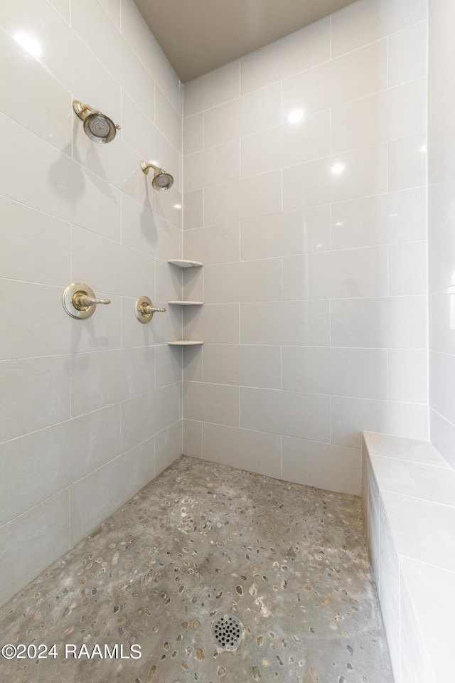 bathroom with a tile shower