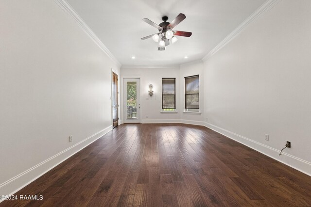 spare room with ornamental molding, ceiling fan, and dark hardwood / wood-style floors