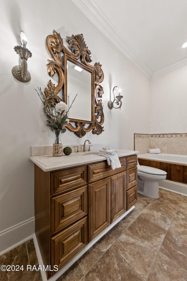 bathroom featuring crown molding, vanity, toilet, and tiled bath