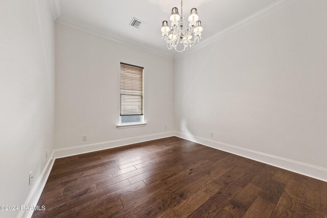 unfurnished room featuring crown molding, dark wood-type flooring, and a chandelier