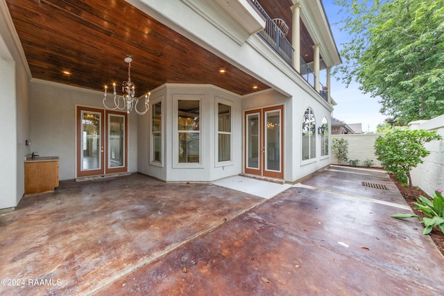 exterior space with a balcony and fence