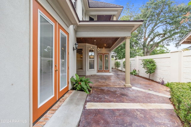 view of patio / terrace featuring french doors and fence