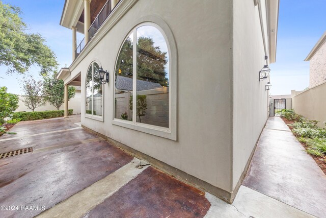 view of side of home with a patio