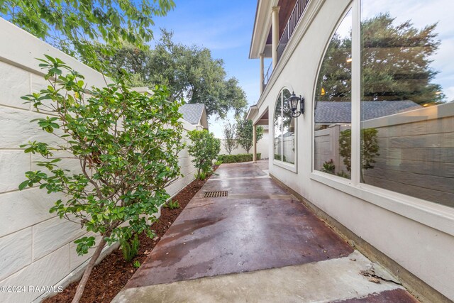 view of side of property featuring a patio