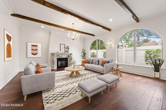 living room featuring a fireplace, crown molding, a chandelier, beamed ceiling, and dark hardwood / wood-style floors