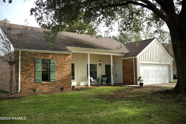 ranch-style home with a garage and a front yard