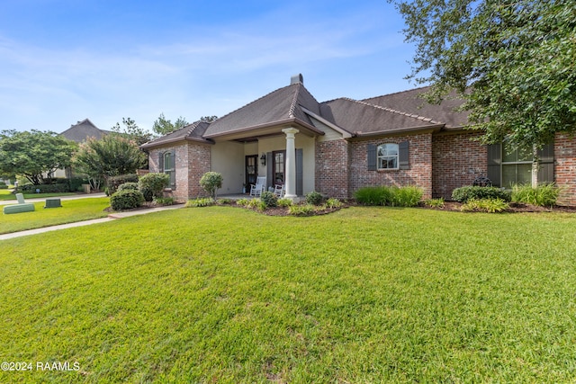 ranch-style home with a front lawn