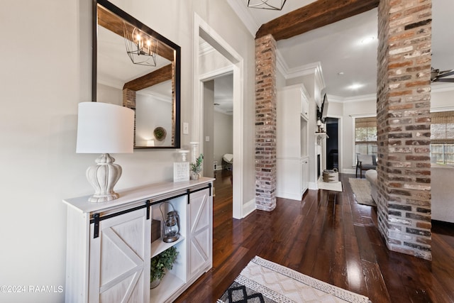 corridor featuring crown molding, dark hardwood / wood-style flooring, and brick wall