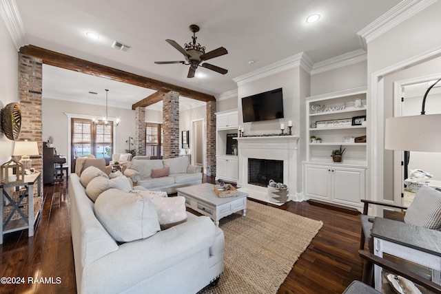 living room featuring built in features, ceiling fan with notable chandelier, dark hardwood / wood-style floors, and crown molding