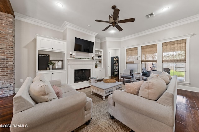 living room featuring ornamental molding, dark hardwood / wood-style flooring, brick wall, and ceiling fan