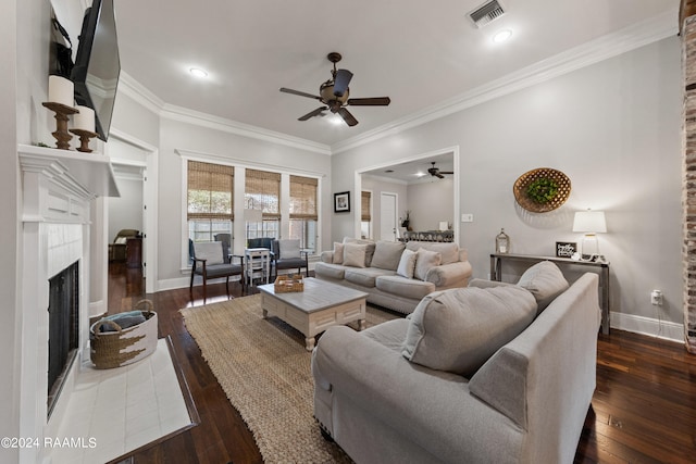 living room with ornamental molding, dark hardwood / wood-style flooring, and ceiling fan