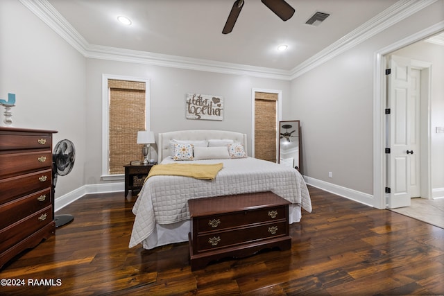 bedroom featuring ceiling fan, dark hardwood / wood-style flooring, and crown molding