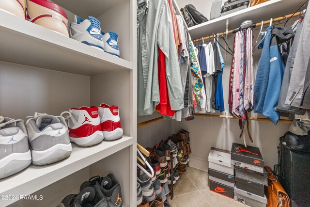 spacious closet featuring tile patterned floors